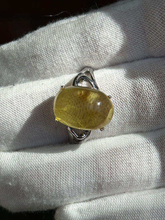 Polished citrine crystal set in silver adjustable ring setting