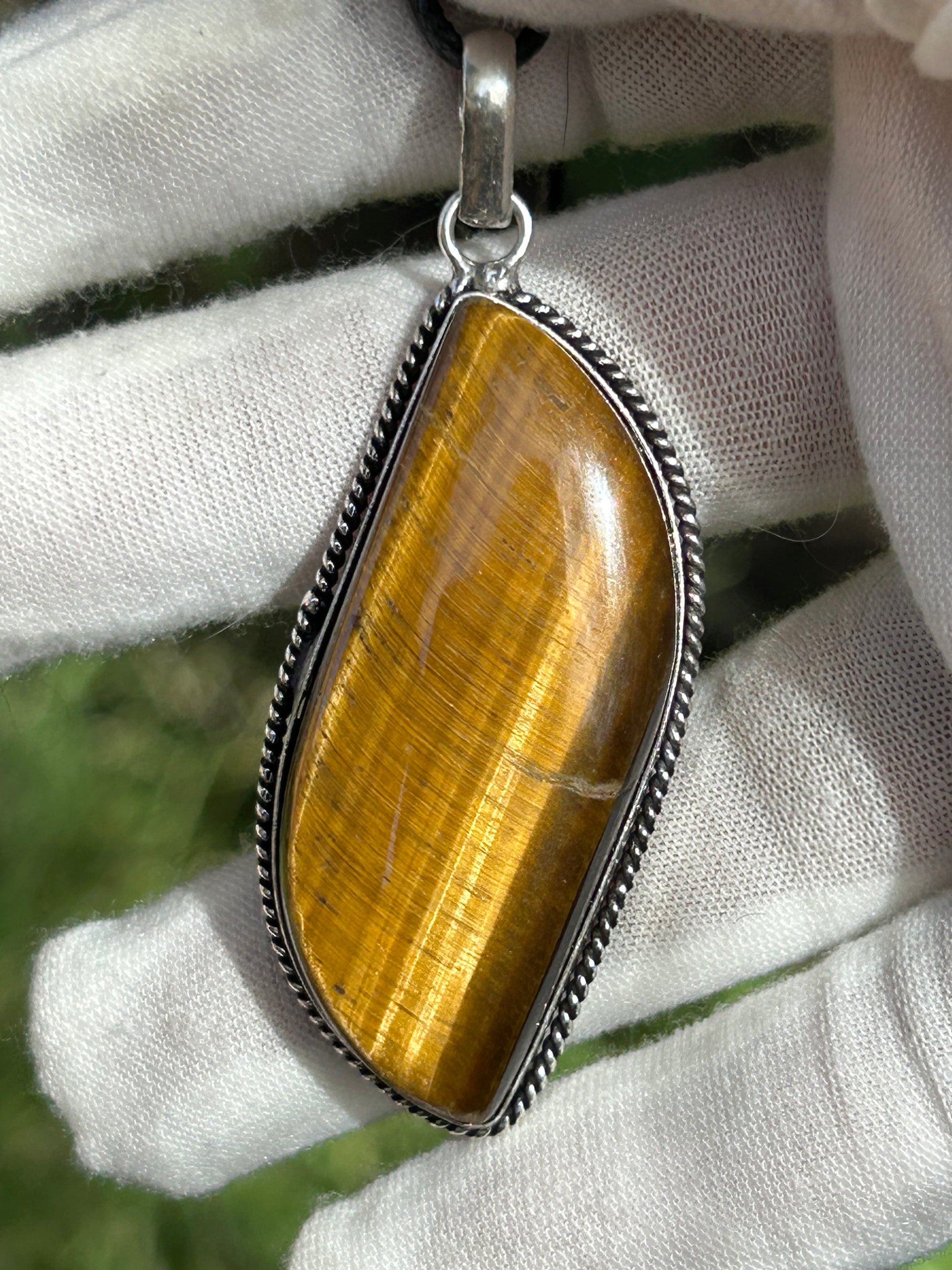 brown gold tigers eye pendant in antique silver setting