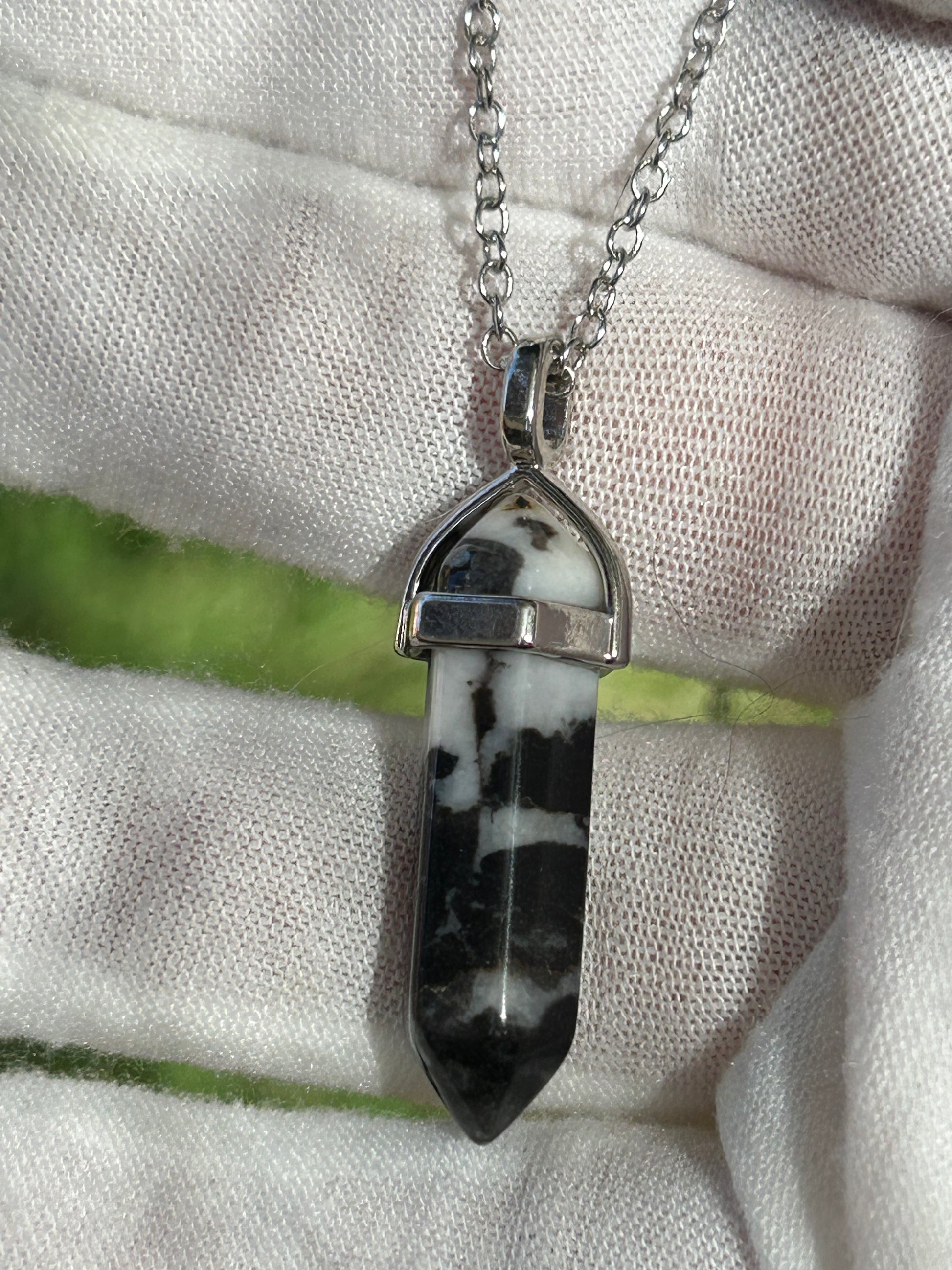 Black and white zebra jasper point pendant with silver necklace