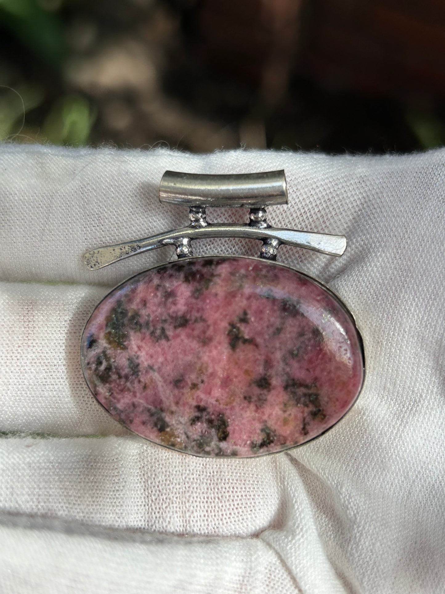 Large oval pink grey rhodonite in unique sterling silver setting