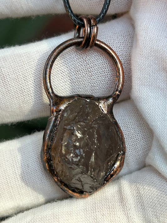 Raw Smoky Quartz pendant in antique rustic copper solder setting with a black cord necklace