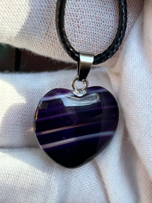 Purple agate polished heart pendant with silver pendant attachment and black cord necklace