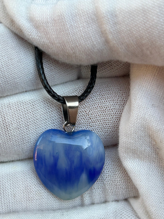 Blue agate polished heart pendant with silver pendant attachment and black cord necklace