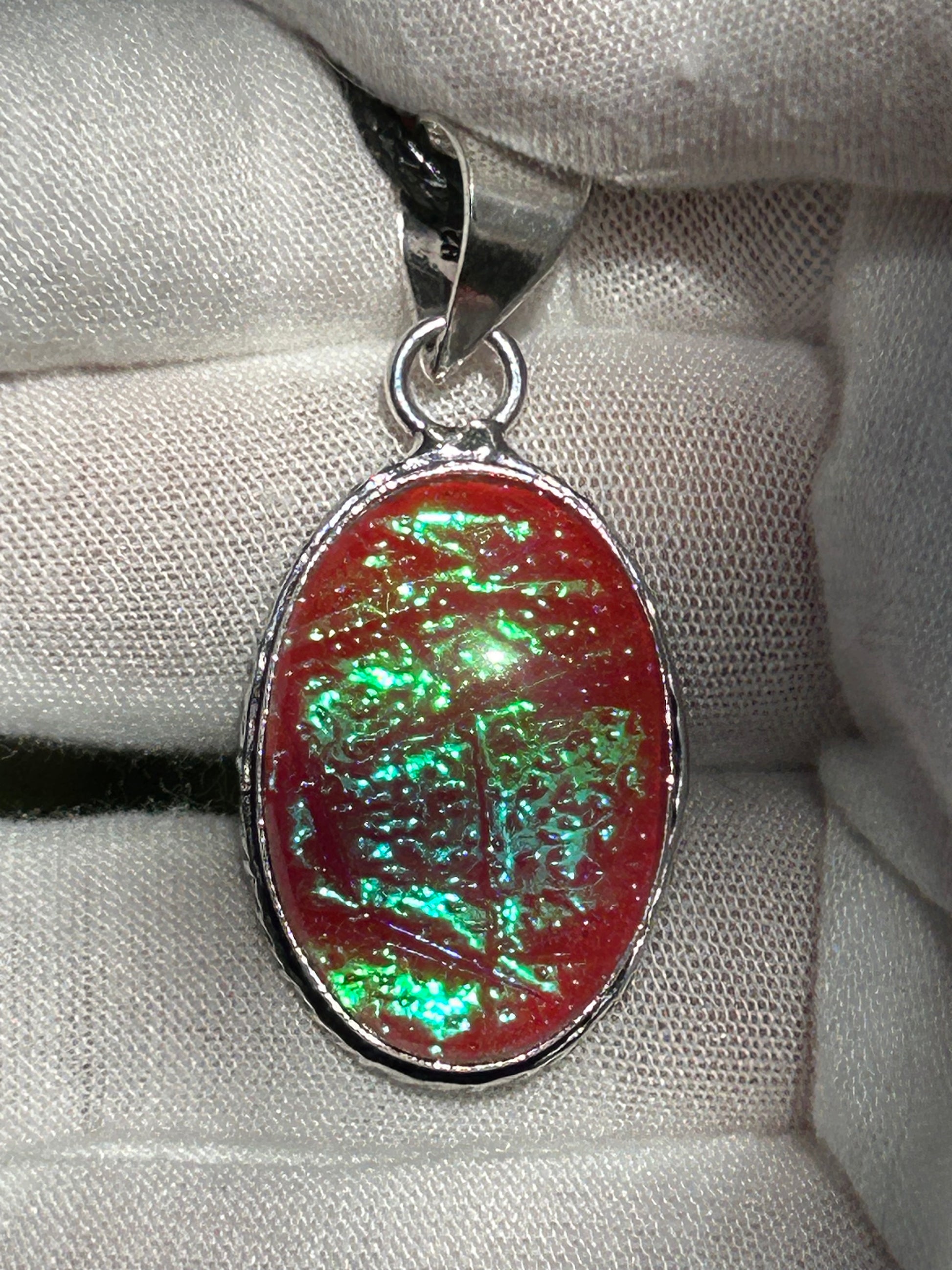 dichroic glass pendant with 925 sterling silver plated setting and black cord necklace