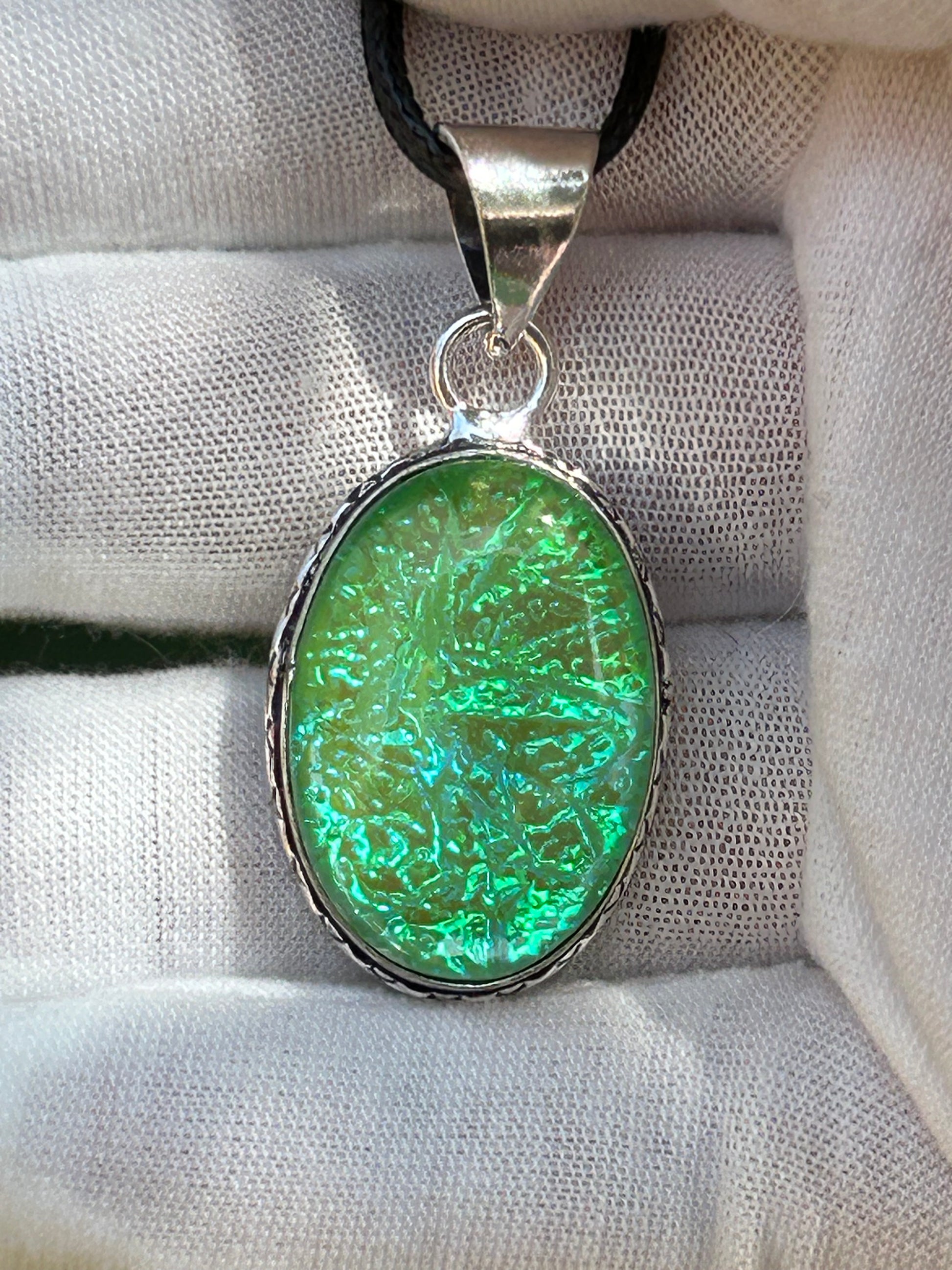 dichroic glass pendant with 925 sterling silver plated setting and black cord necklace