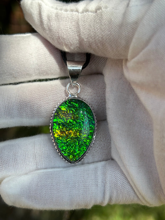 dichroic glass pendant with 925 sterling silver plated setting and black cord necklace