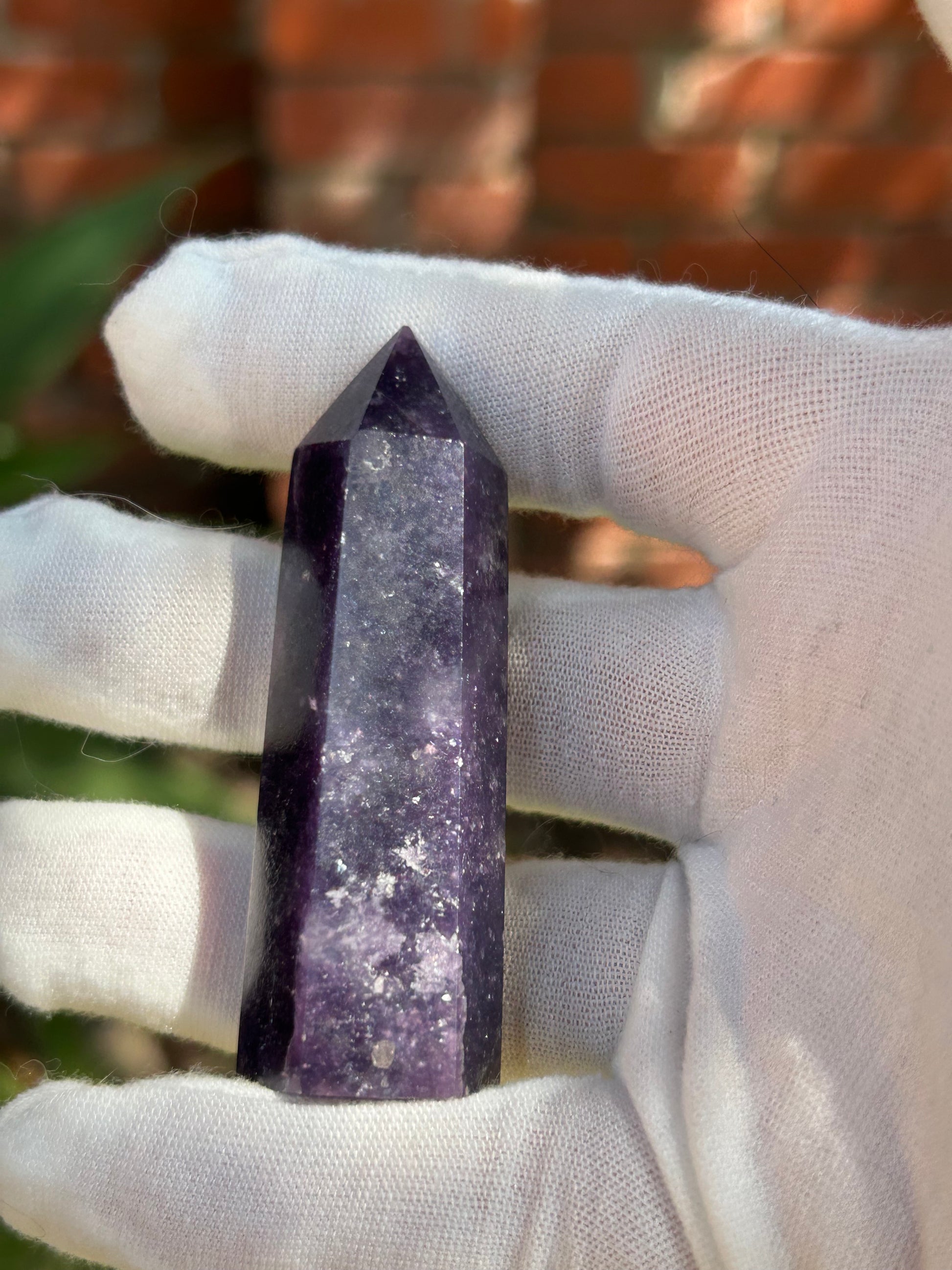 Purple lepidolite crystal point
