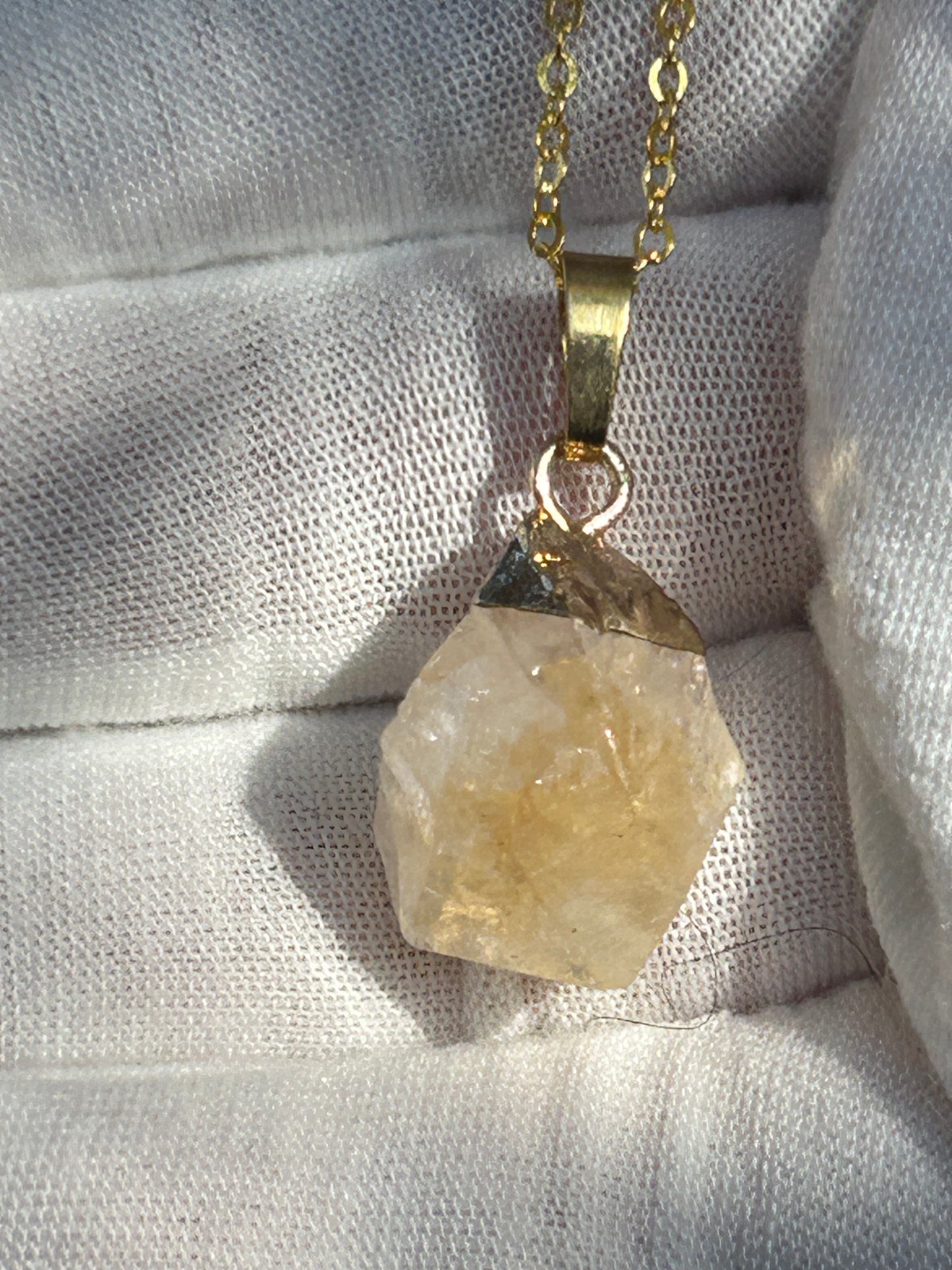 raw citrine pendant dipped in gold brass with matching brass necklace