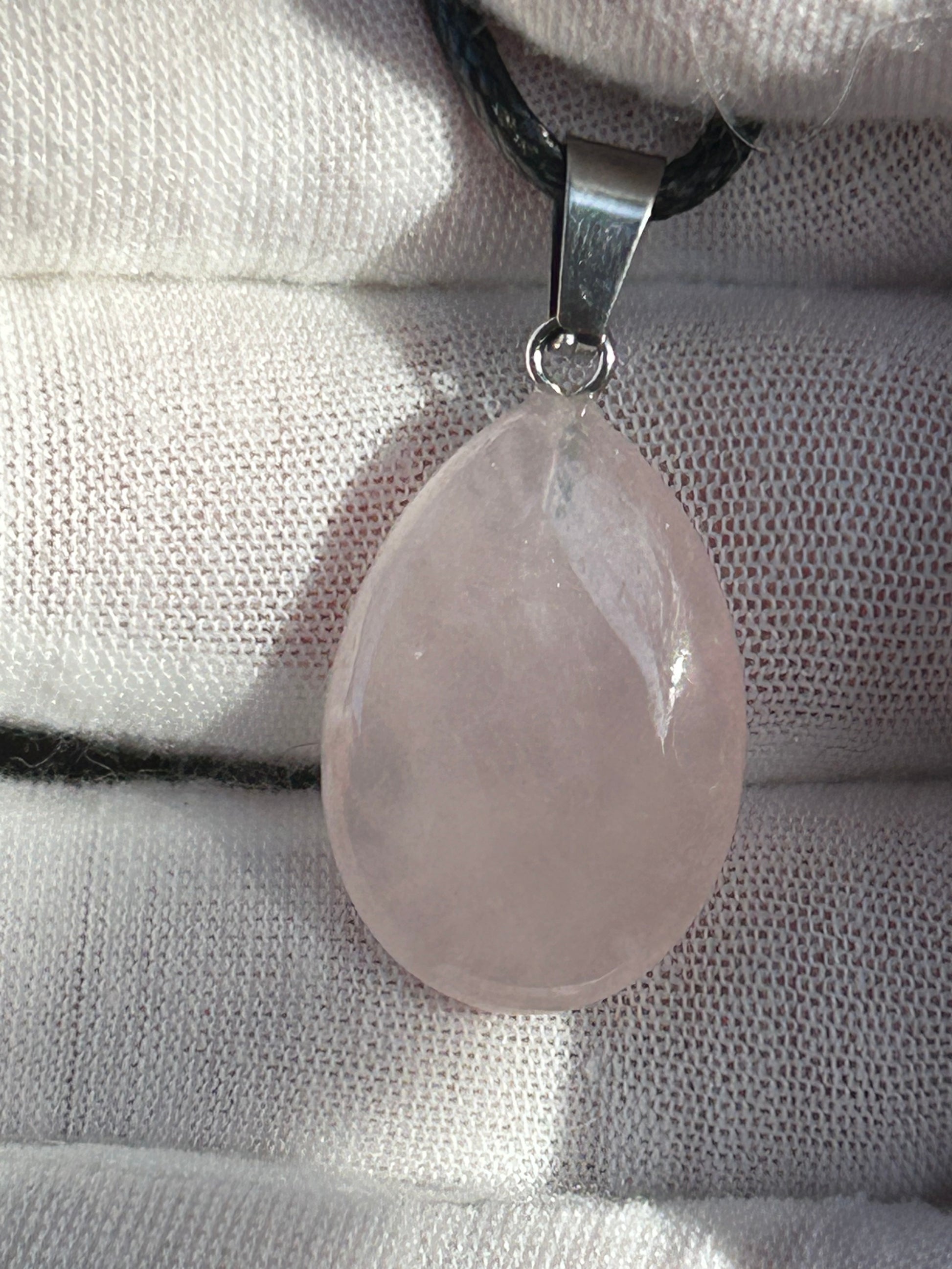 Rose Quartz Polished Rain Drop Pendant with silver pendant attachment and black cord necklace