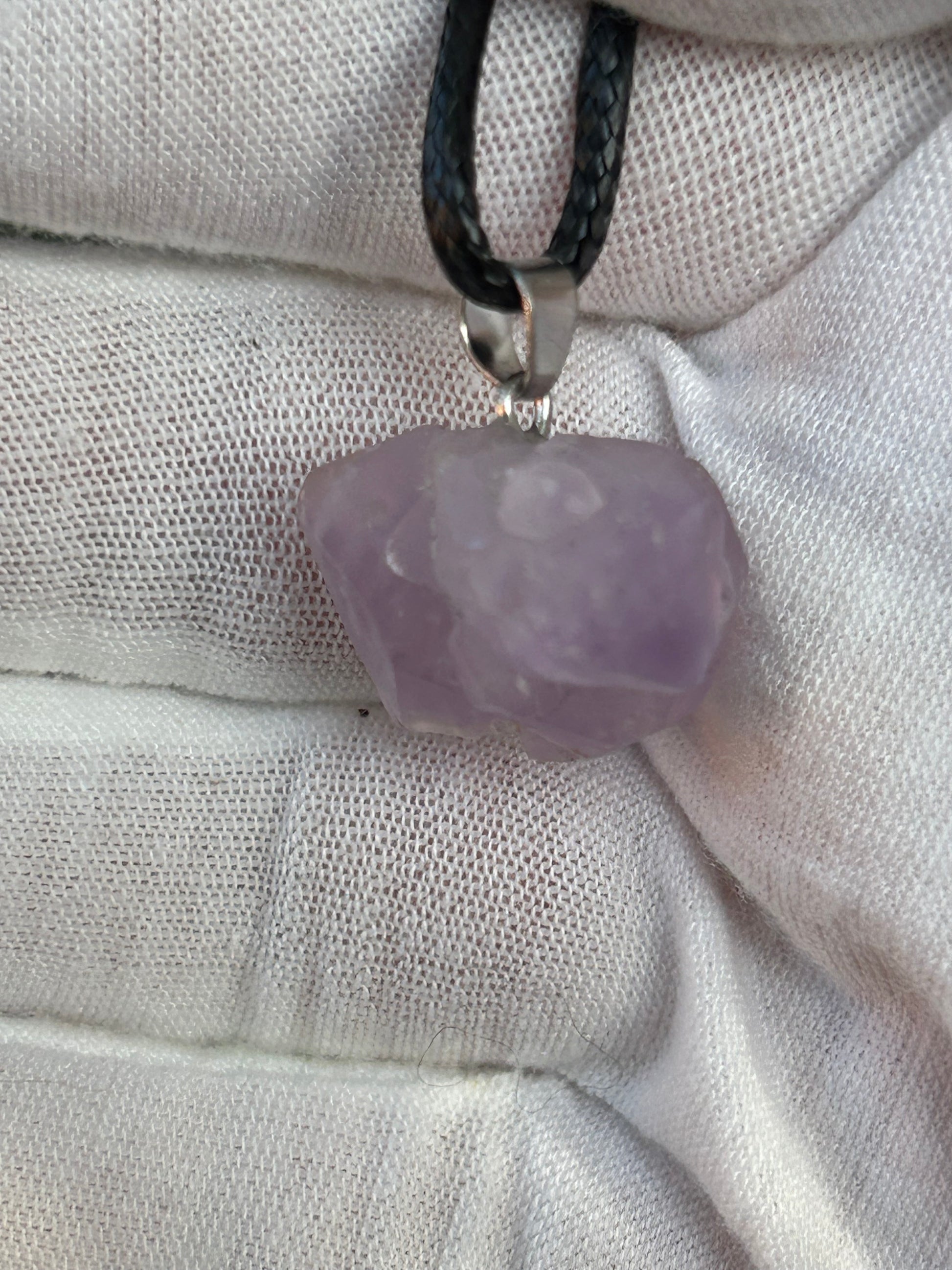 Raw Amethyst Crystal Pendant with silver pendant attachment and black cord necklace