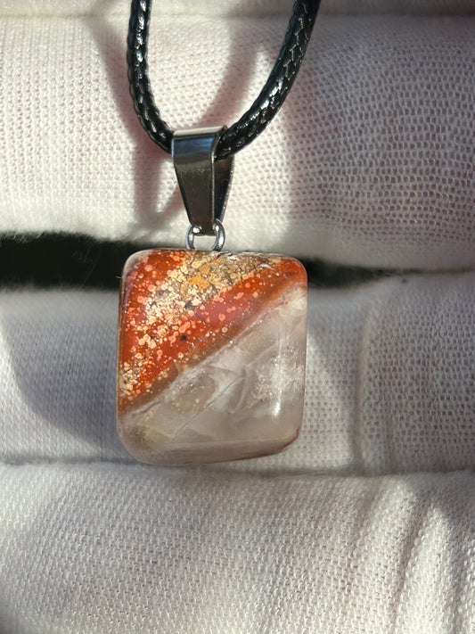 Crazy Lace Agate Polished Stone Pendant. Brown red gold tones with silver pendant attachment and black cord necklace