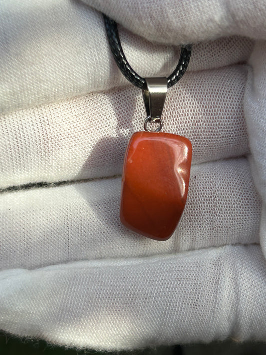 Red Jasper Polished Pendant with silver pendant attachment and black cord necklace