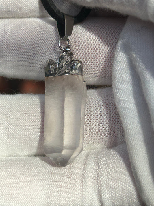 Clear quartz shard pendant with silver top and pendant attachment and black cord necklace