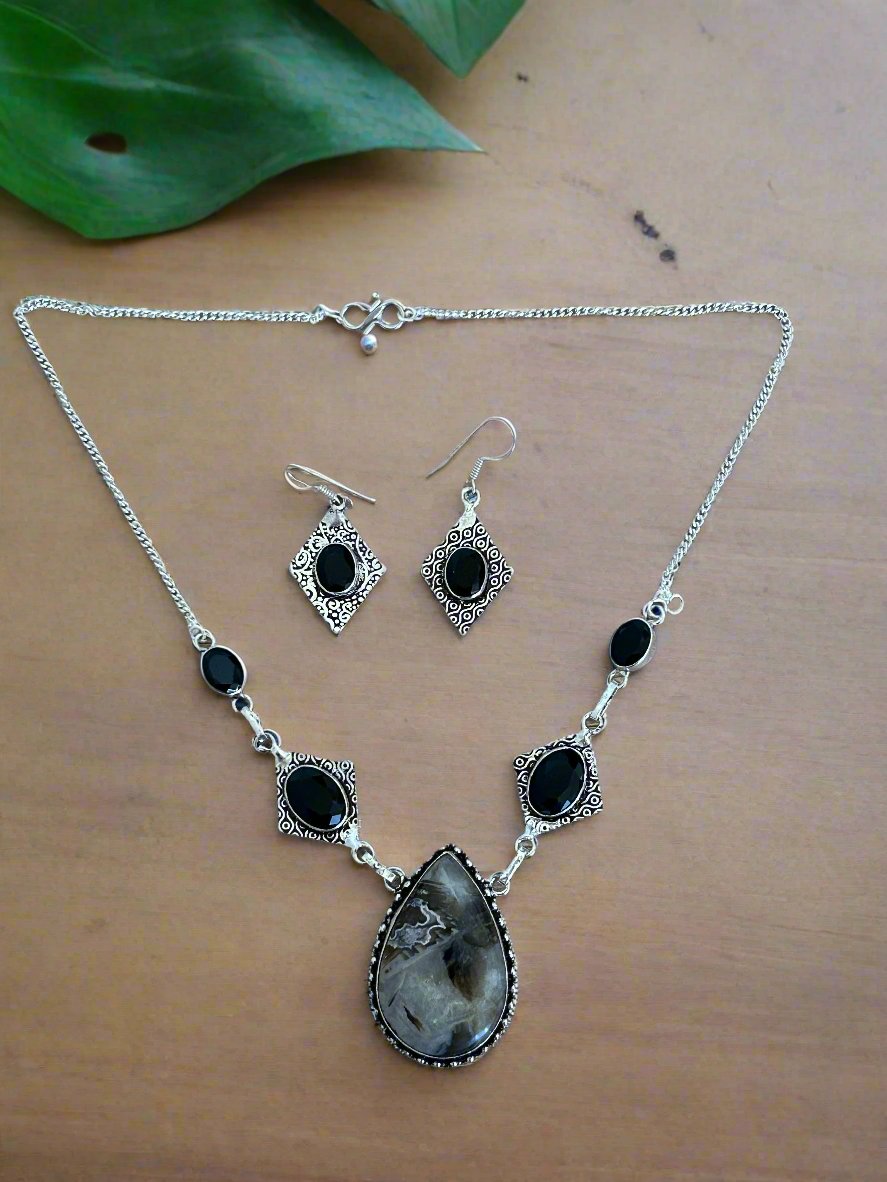 Stick Agate, Black Onyx and 925 Sterling Earrings and and Necklace Set. The necklace features a large stick agate water drop stone and 4 black onyx gems, and the earrings have one black onyx gem per piece.