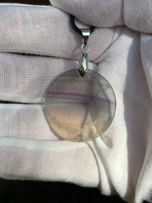 Rainbow Fluorite Circular Pendant with silver pendant attachment and black cord necklace