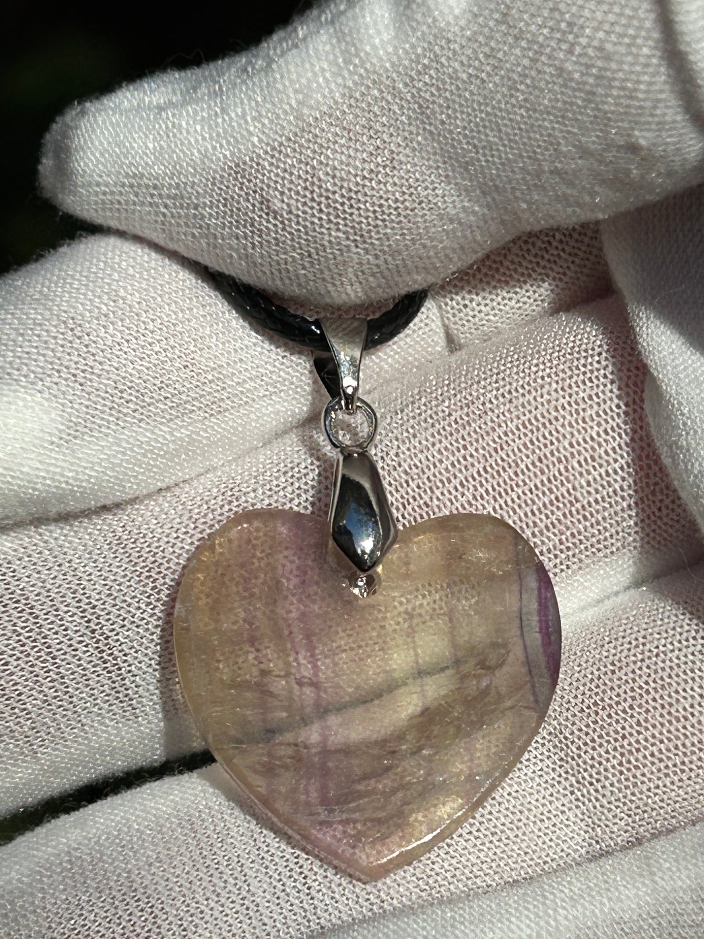 Rainbow Fluorite Heart Pendant pendant with silver pendant attachment and black cord necklace