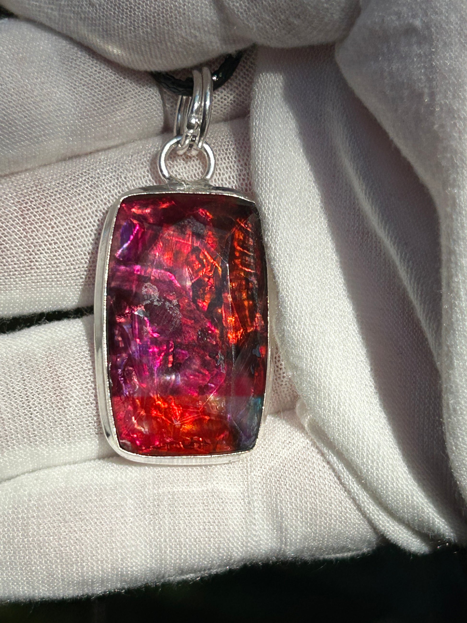 Ammolite Pendant in Sterling Silver Setting orange and pink tones