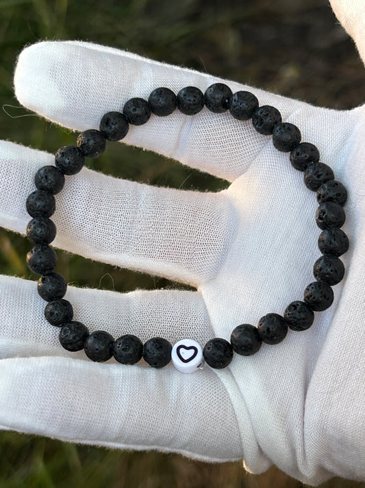 black lava rock bead bracelet with heart emblem