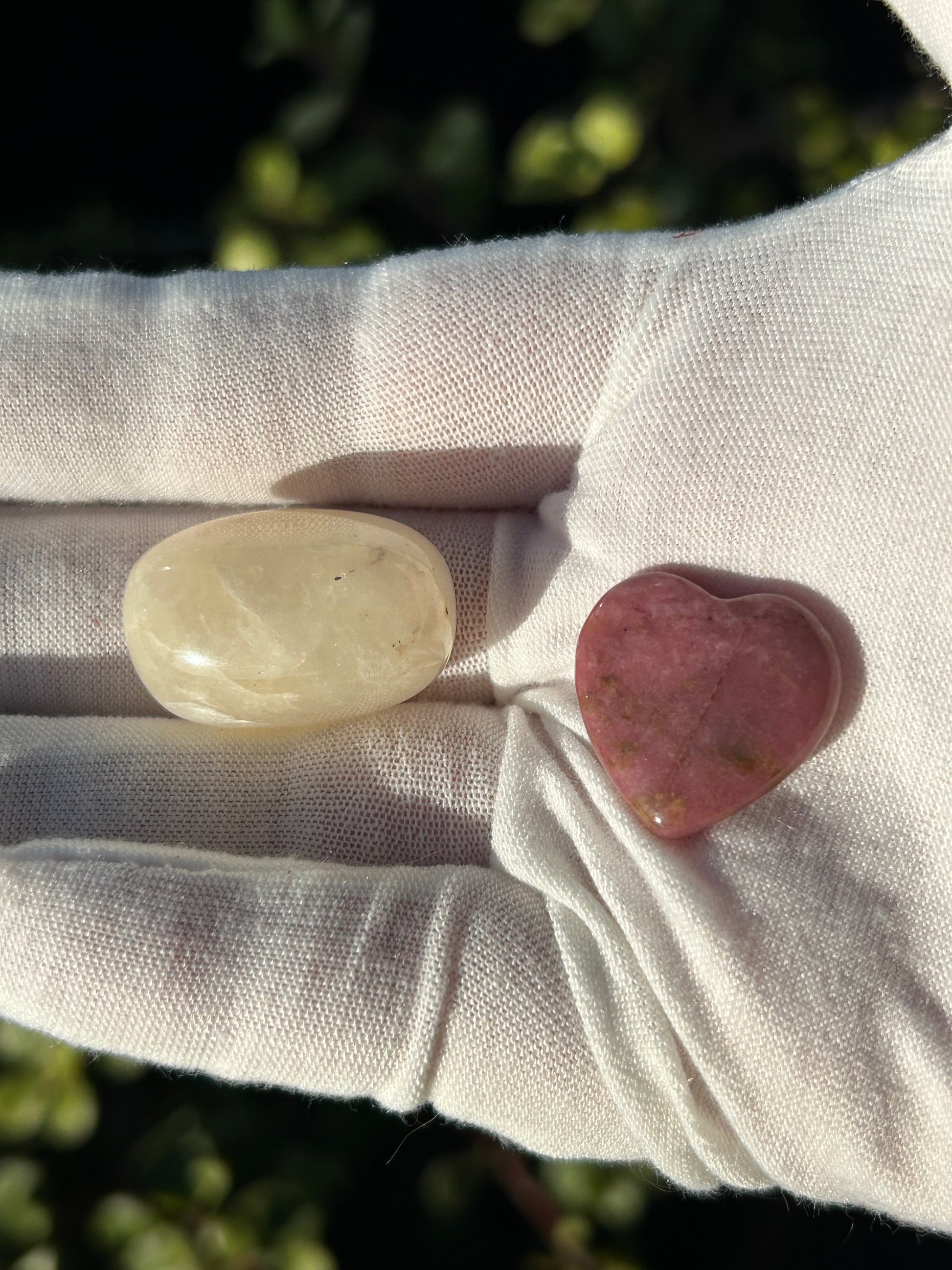 white quartz polished stone and rhodonite heart