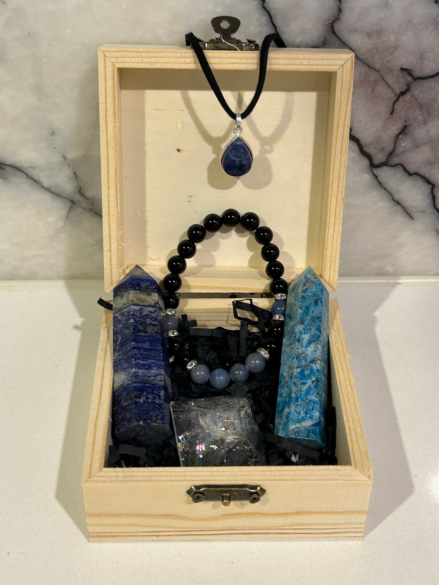 Treasure chest with various crystals and jewellery