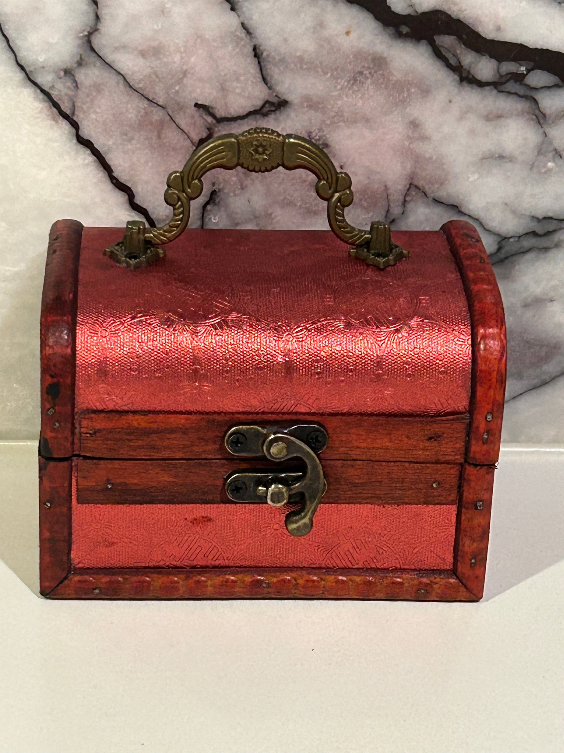 Red embossed antique style wooden treasure chest