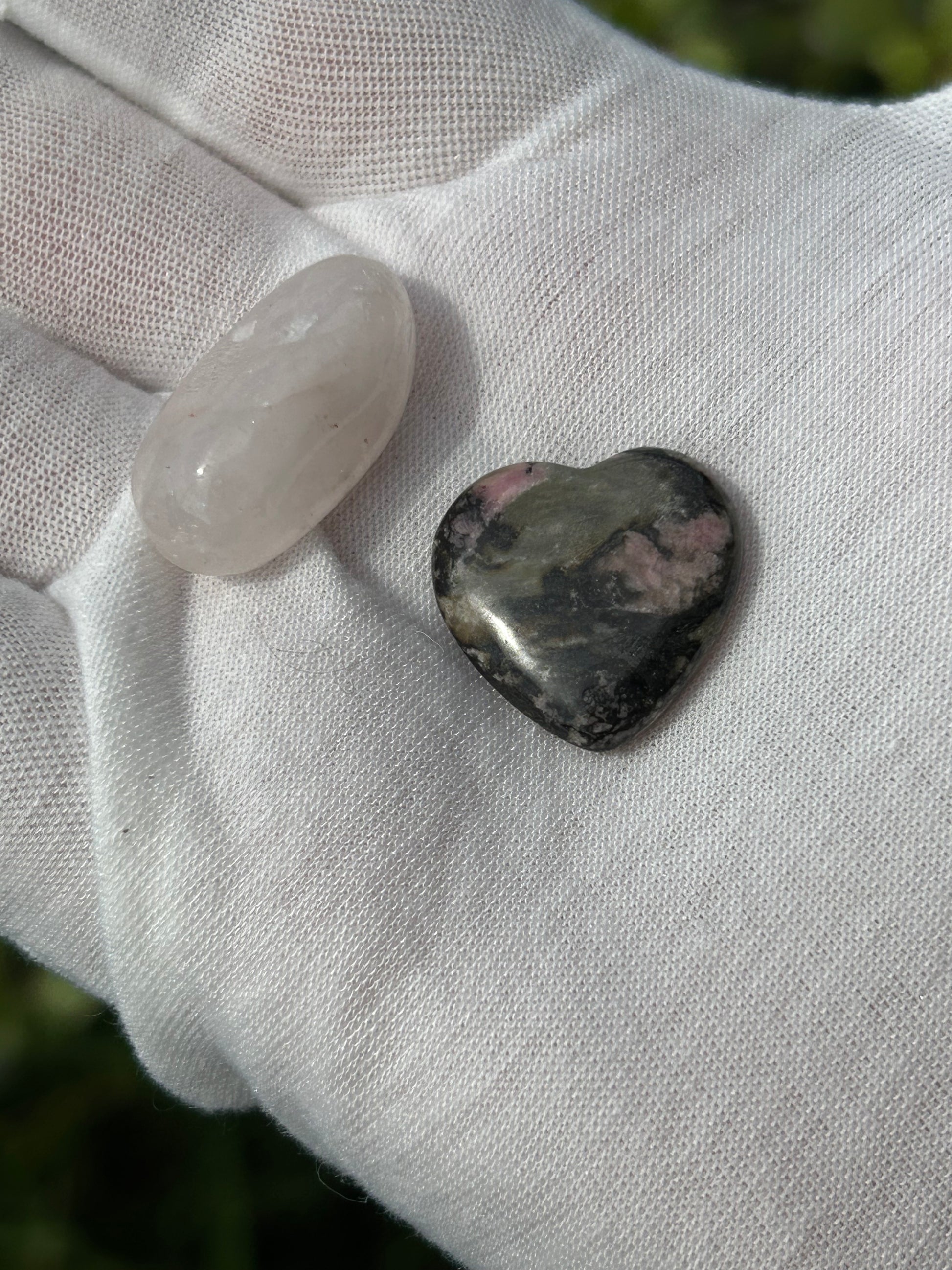 White Quartz polished stone and rhodonite polished heart stone