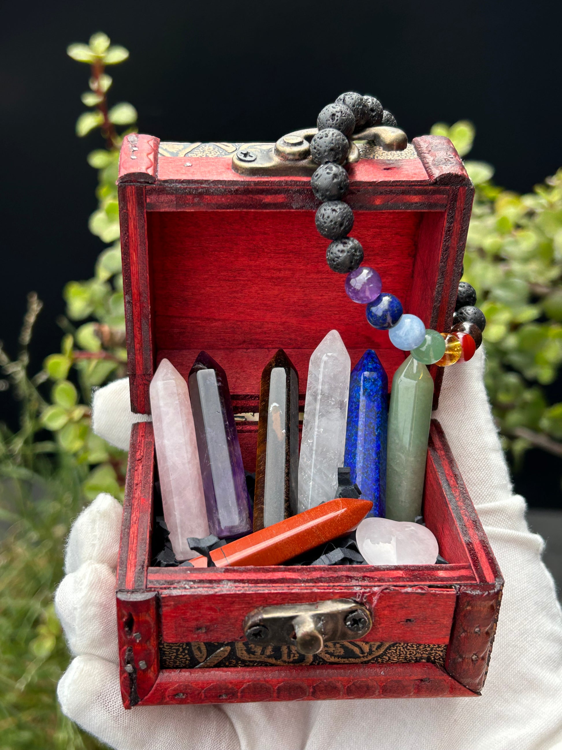 Chakra balancing treasure chest with lava rock chakra bracelet and various crystals