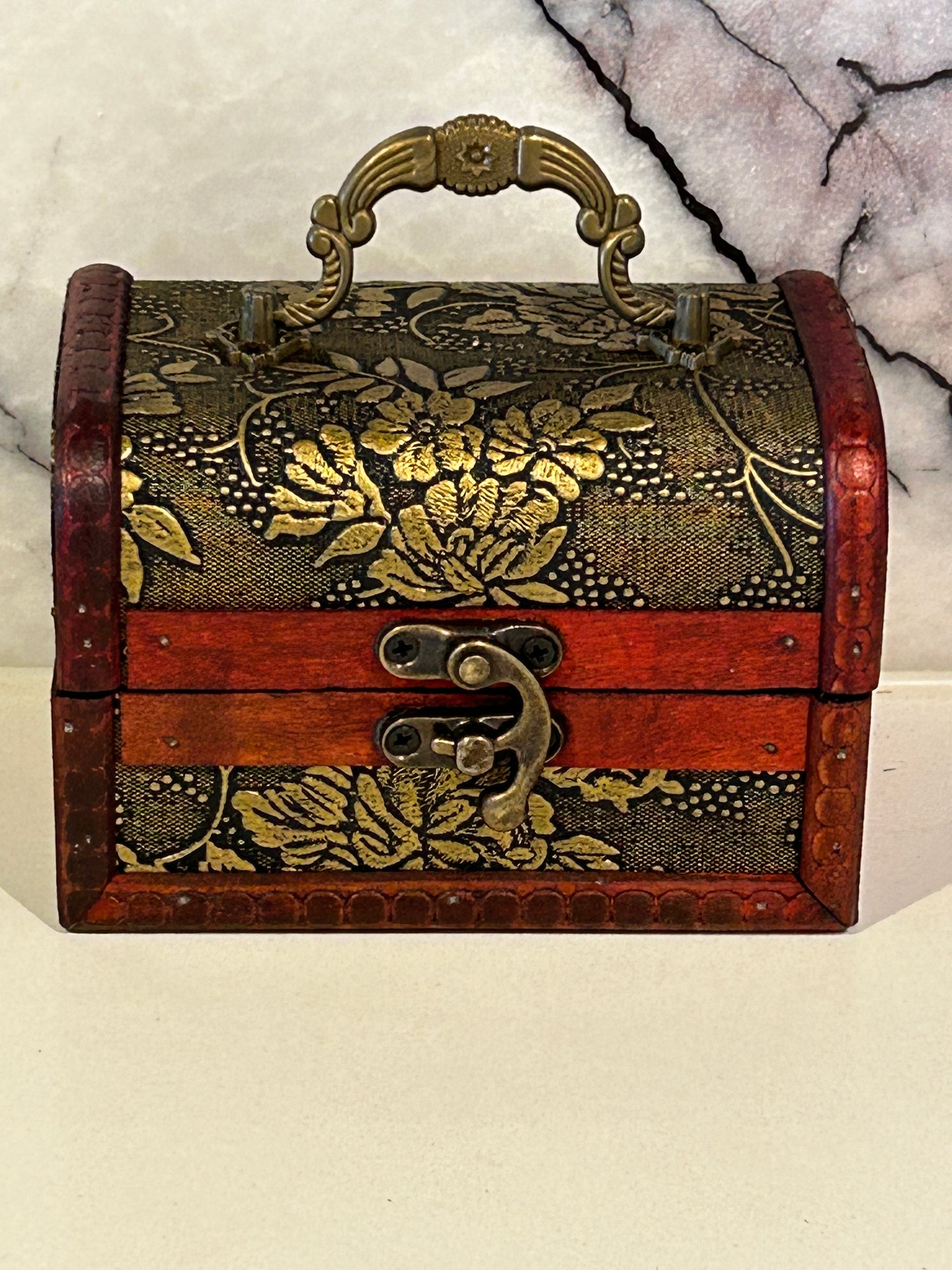 Embossed antique style wooden box or treasure chest with handle