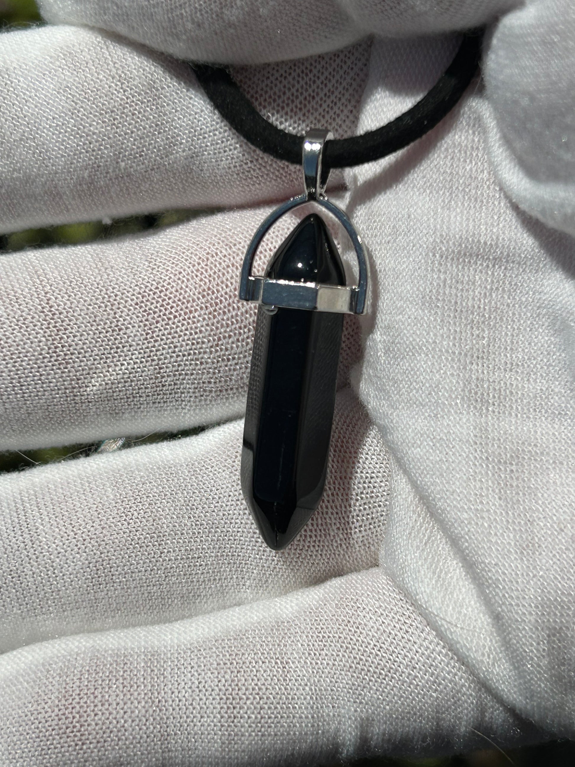 Black Obsidian Point Pendant with silver fittings and black cord necklace.