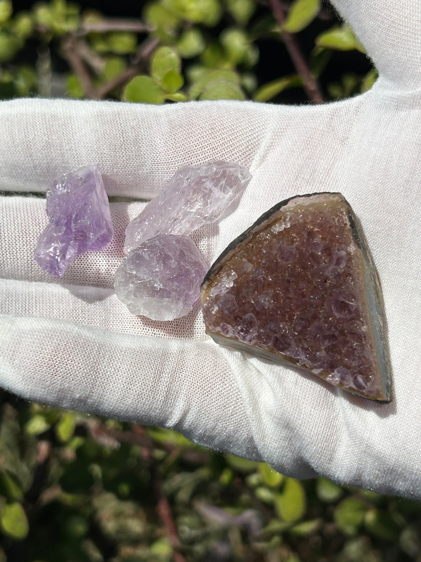 Amethyst cluster and 3 raw amethyst stones