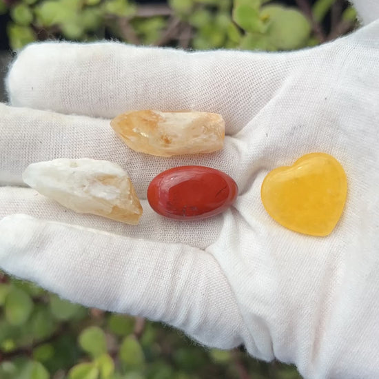 2 citrine crystal shards, red jasper polished stone, and yellow jade polished heart